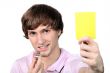 Referee showing the yellow card
