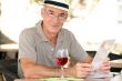 Retiree enjoying a glass of wine