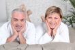 senior couple lying in bed