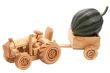 Toy tractor with green pumpkin.