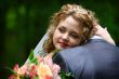 Bride embracing groom