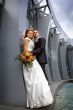 Bride and groom near collonnade