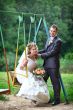 Bride and groom on swing