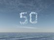 cloudy number fifty over water