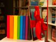 E-book tied up with red ribbon and row of books