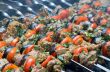 Cooking tasty kebab with vegetables