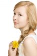 A pretty girl with a yellow flower, isolated