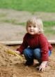 child plays with sand