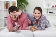 Young couple watching television