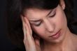 Closeup of a woman with a headache