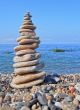 Balanced stones on the seashore summertime