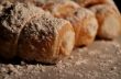 Cream filled pastries covered in powdered sugar.