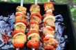 Image with fried meat, tomato and onion