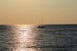 Seascape with calm water and sailboat