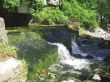 Low and wide waterfall. Abhazia travel