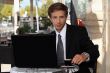 Young businessman having coffee outdoors