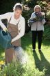Woman gardening with her grandmother