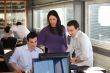 Group of collaborators in front of computer