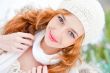 Portrait of beautiful young red hair woman outdoors in winter lo