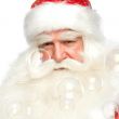 Santa Claus portrait smiling isolated over a white background an
