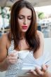 Closeup portrait of a pretty young female having a cup of coffee