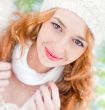 Portrait of beautiful young red hair woman outdoors in winter lo