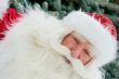 Portrait of Santa Claus standing with hand on chin outdoors at c