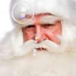 Santa Claus portrait smiling isolated over a white background an