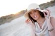 Summer portrait of beautiful woman wearing hat. Vacation at warm