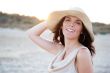 Summer portrait of beautiful carefree woman wearing hat. Vacatio