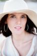 Summer portrait of beautiful woman wearing hat. Vacation at warm
