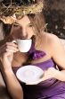 Young beautiful lady drinking coffee