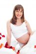 Image of pregnant woman touching her belly with hands