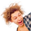 Portrait of funny young man with awesome hairdo isolated on whit
