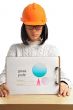 Young architect-woman wearing a protective helmet