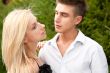 Young couple playing around in the nature - side view. Lots of c