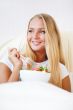 Closeup portrait of a beautiful slender girl eating healthy food