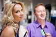 Young attractive happy couple shopping at mall. 
