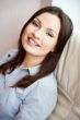 Closeup portrait of cute young business woman smiling