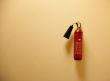 Fire extinguisher on the yellow wall