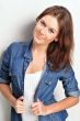 Portrait of a beautiful young woman wearing a denim shirt, tuggi