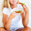 Woman having breakfast in bed. Healthy continental breakfast. Ca