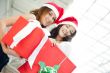 Young happy girls in Christmas hats.Standing together indoors an