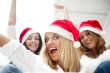 Group of three happy pretty girls are celebrating christmas and 