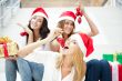 Group of three beautiful girls sitting on stairs at shopping mal