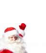 Santa Claus pointing his hand isolated over white.