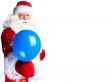 Traditional Santa Claus holding balloons for children. Isolated 