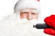 Traditional Santa Claus holding 3g usb modem in his arm on foreg