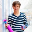 Portrait of young man inside shopping mall standing relaxed and 