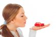 Closeup portrait of young pretty woman holding retro car in her 